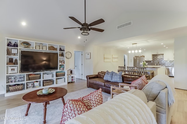 129 Marcie Dr, Long Beach, MS 39560 - living area with ceiling fan, light wood-style floors, high vaulted ceiling, and recessed lighting