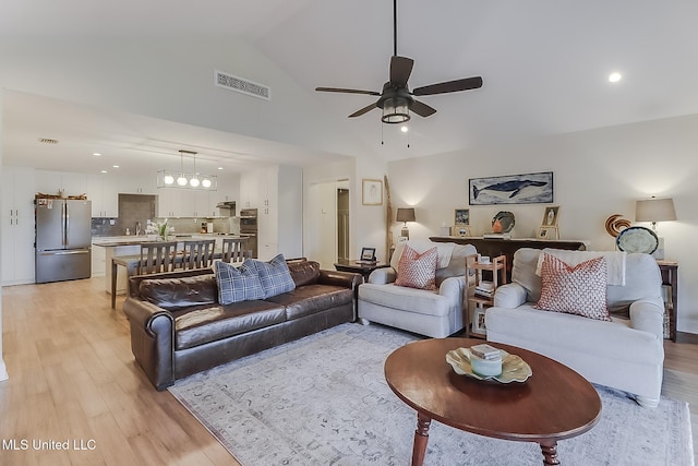 129 Marcie Dr, Long Beach, MS 39560 - living area with ceiling fan, light wood-style flooring, vaulted ceiling, and recessed lighting