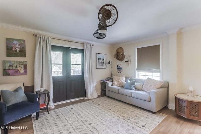129 Marcie Dr, Long Beach, MS 39560 - living room with plenty of natural light, light wood finished floors, ornamental molding, and baseboards
