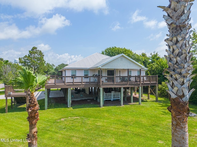 129 Marcie Dr, Long Beach, MS 39560 - rear view of property featuring a wooden deck and a lawn