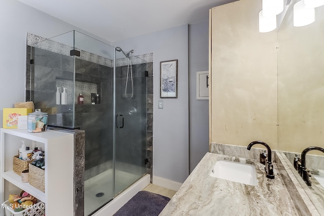 129 Marcie Dr, Long Beach, MS 39560 - full bathroom featuring vanity, a shower stall, and baseboards