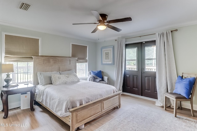 129 Marcie Dr, Long Beach, MS 39560 - bedroom featuring light wood-type flooring, crown molding, ceiling fan, and access to outside