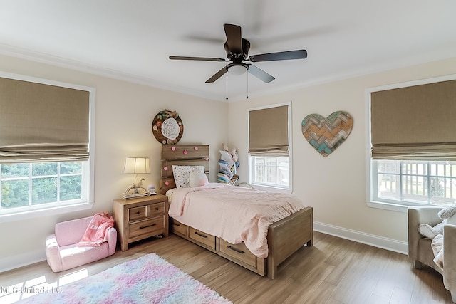 129 Marcie Dr, Long Beach, MS 39560 - bedroom featuring light wood finished floors, baseboards, crown molding, and ceiling fan
