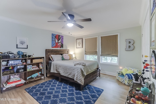 129 Marcie Dr, Long Beach, MS 39560 - bedroom featuring wood finished floors, a ceiling fan, and crown molding