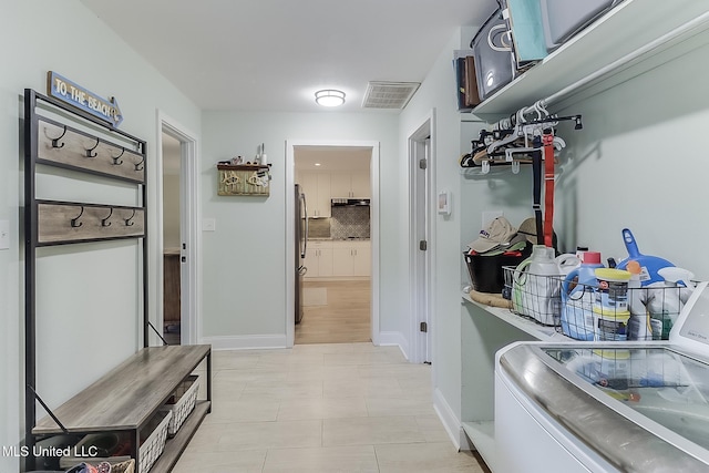 129 Marcie Dr, Long Beach, MS 39560 - laundry area with separate washer and dryer and baseboards