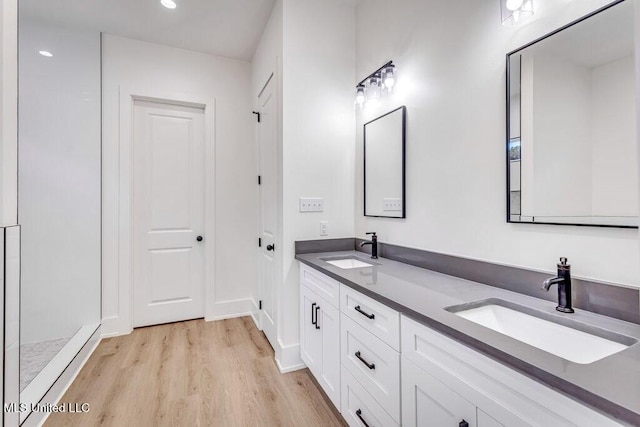 bathroom featuring hardwood / wood-style floors and vanity