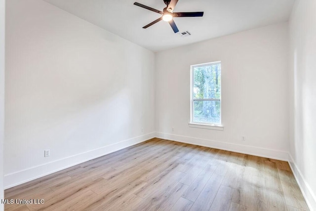 unfurnished room featuring ceiling fan and light wood-type flooring