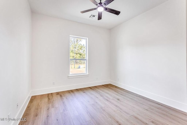 spare room with ceiling fan and light hardwood / wood-style flooring