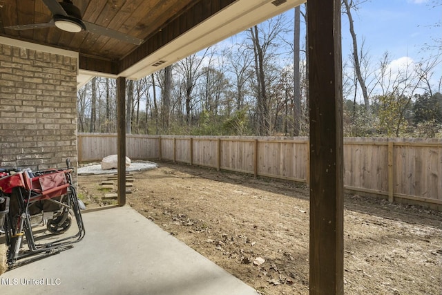 view of yard with a patio area and ceiling fan