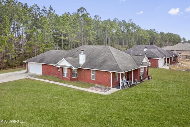 view of front of home featuring a garage and a front yard