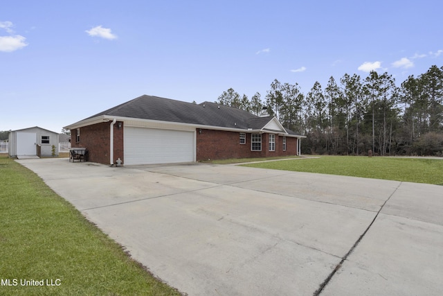 view of front of house featuring a garage and a front lawn