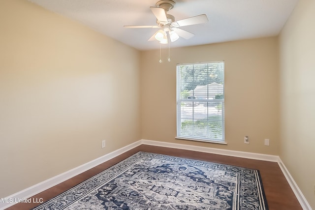 empty room with hardwood / wood-style flooring and ceiling fan