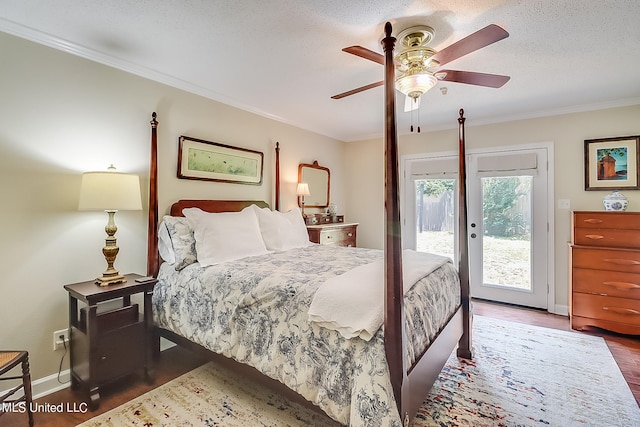 bedroom featuring a textured ceiling, hardwood / wood-style floors, access to exterior, ceiling fan, and crown molding