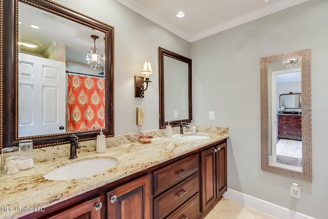 bathroom featuring vanity, crown molding, and tile patterned flooring