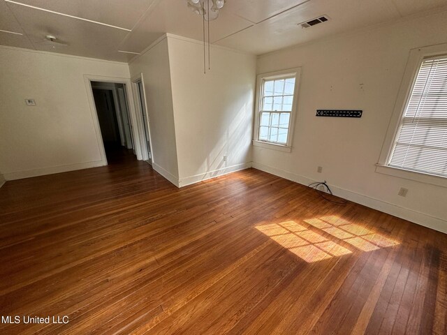 500 Avery St, Cleveland, MS 38732 - spare room with hardwood / wood-style flooring, crown molding, and baseboards