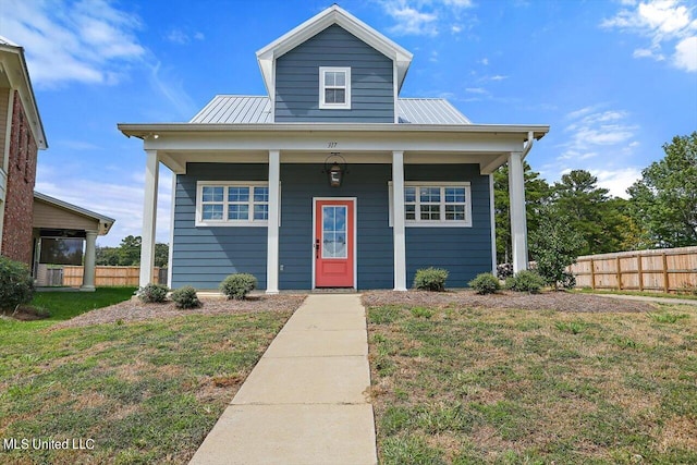 view of front of property featuring a front yard and covered porch