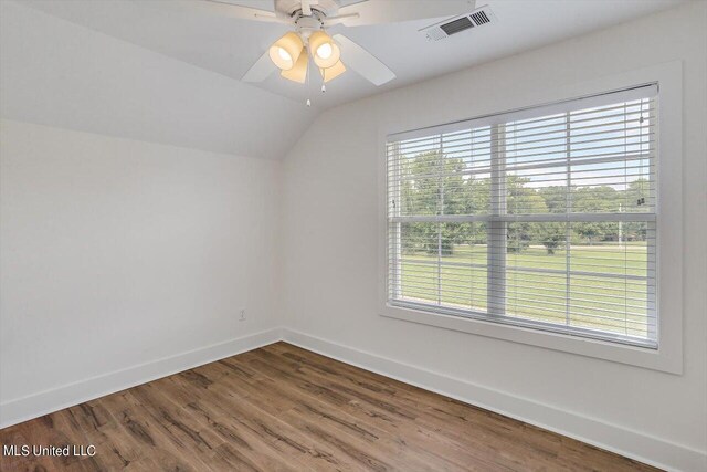 spare room featuring ceiling fan, hardwood / wood-style flooring, and lofted ceiling