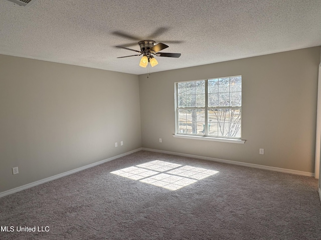 carpeted empty room with a textured ceiling and ceiling fan