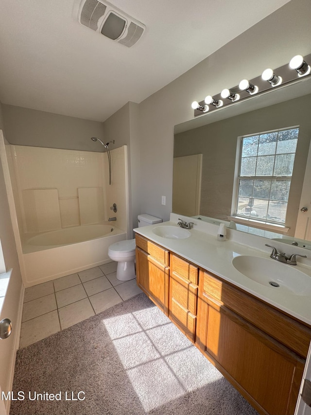 full bathroom with shower / bathtub combination, tile patterned floors, toilet, and vanity