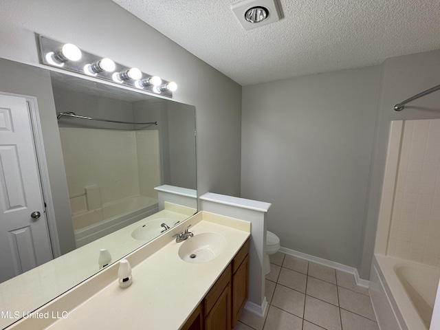 full bathroom featuring toilet, tub / shower combination, a textured ceiling, vanity, and tile patterned flooring