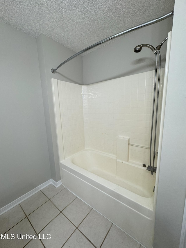 bathroom featuring tub / shower combination, tile patterned floors, and a textured ceiling