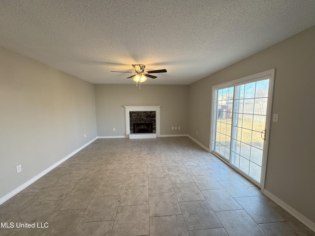 unfurnished living room with light tile patterned floors, a textured ceiling, and ceiling fan