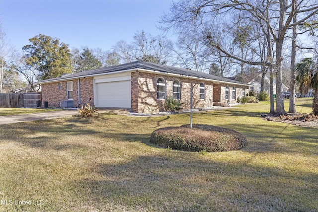 single story home featuring brick siding, an attached garage, a front yard, fence, and driveway