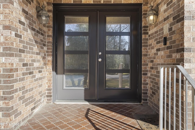 entrance to property with brick siding