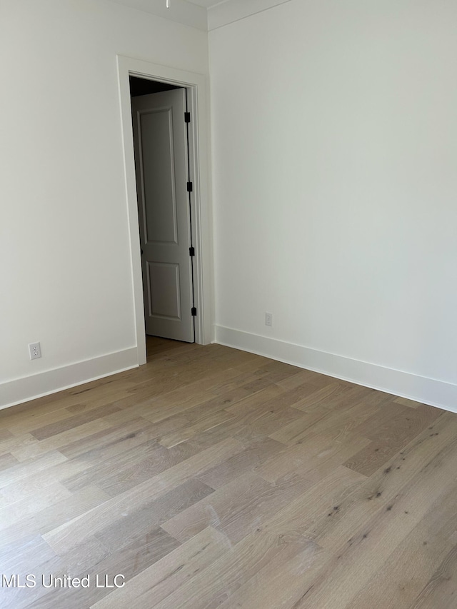 unfurnished room featuring light hardwood / wood-style floors