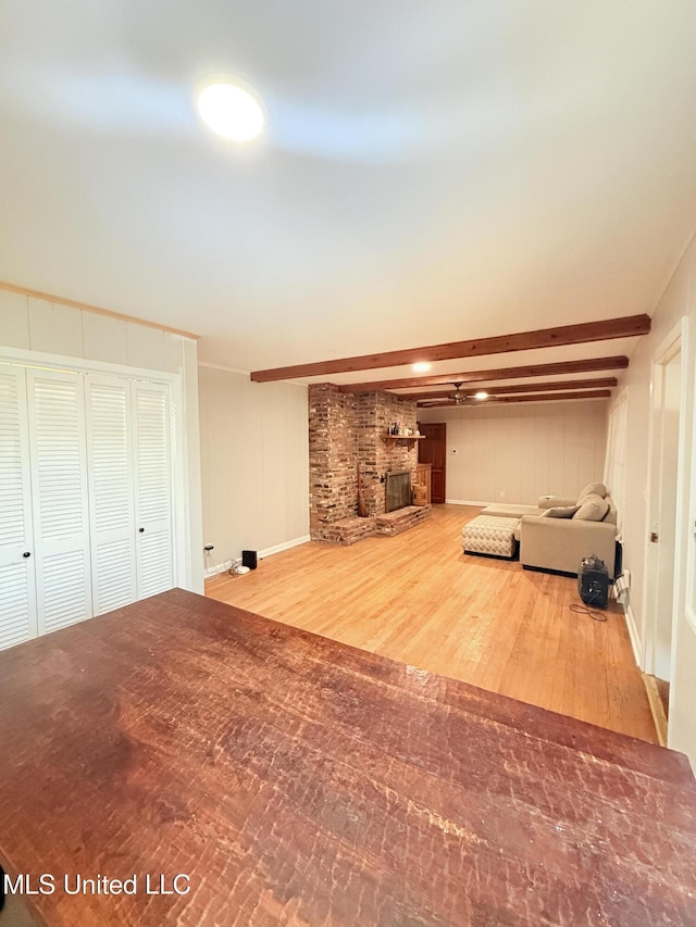 820 Ave Of Pines St, Grenada, MS 38901 - basement featuring hardwood / wood-style flooring and a brick fireplace
