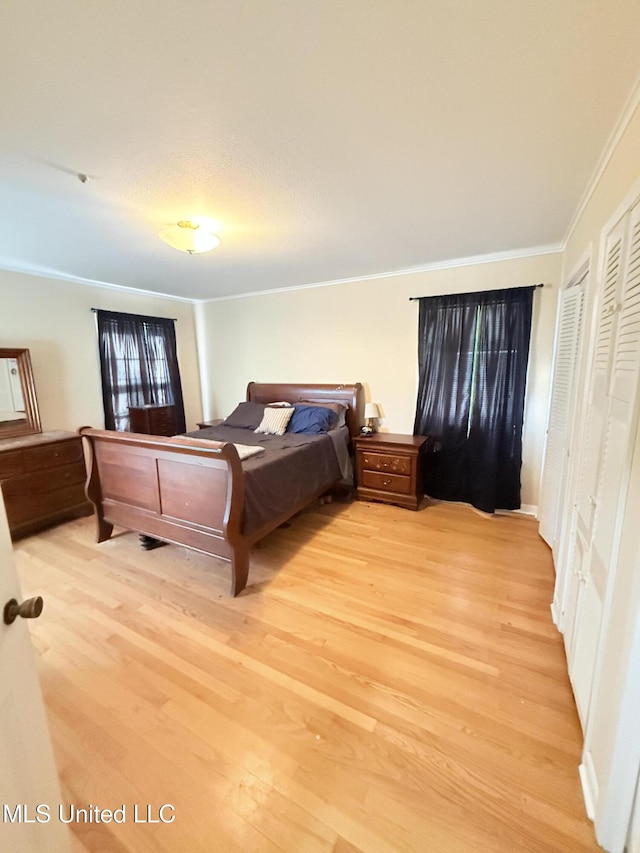 820 Ave Of Pines St, Grenada, MS 38901 - bedroom featuring crown molding and light hardwood / wood-style floors