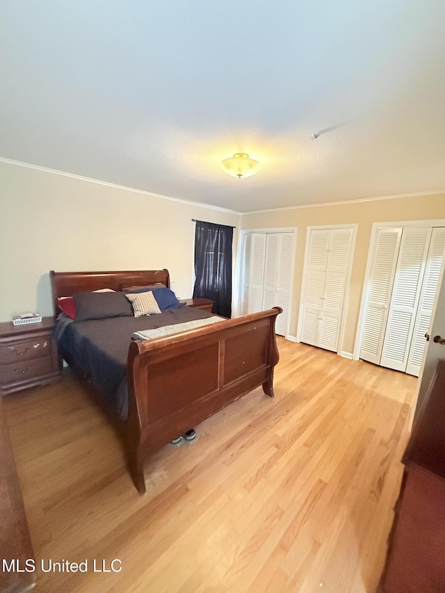 820 Ave Of Pines St, Grenada, MS 38901 - bedroom featuring two closets and light hardwood / wood-style flooring