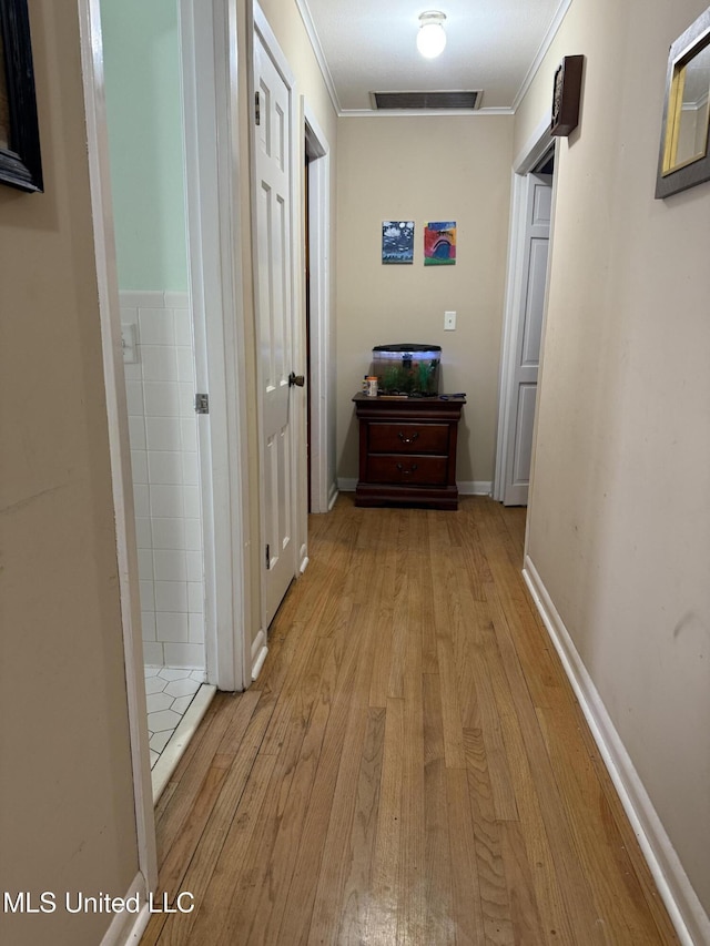 820 Ave Of Pines St, Grenada, MS 38901 - corridor with crown molding and light hardwood / wood-style flooring