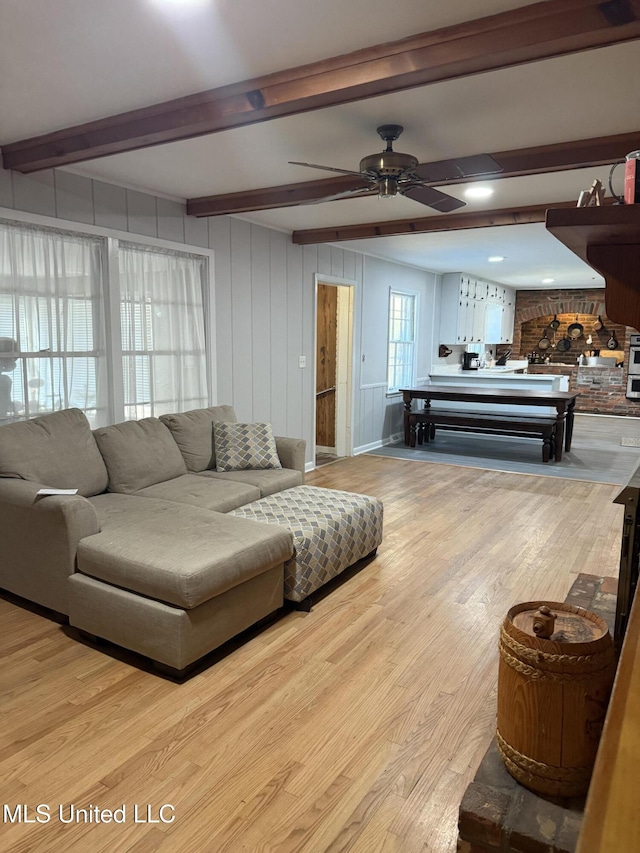 820 Ave Of Pines St, Grenada, MS 38901 - living room with beam ceiling, light hardwood / wood-style flooring, and ceiling fan