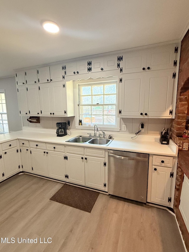820 Ave Of Pines St, Grenada, MS 38901 - kitchen featuring white cabinetry, sink, dishwasher, and light wood-type flooring