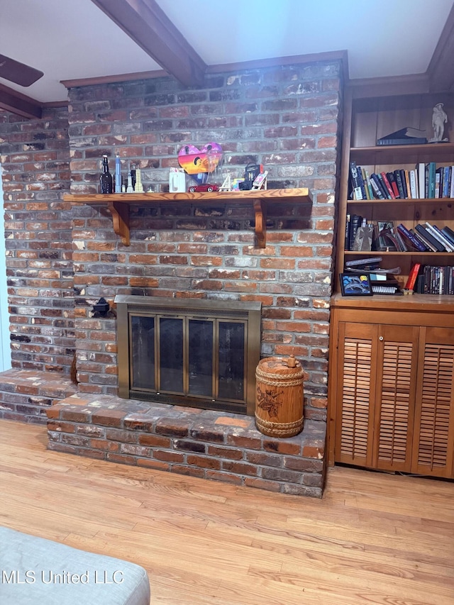 820 Ave Of Pines St, Grenada, MS 38901 - details featuring beam ceiling, hardwood / wood-style floors, and a brick fireplace