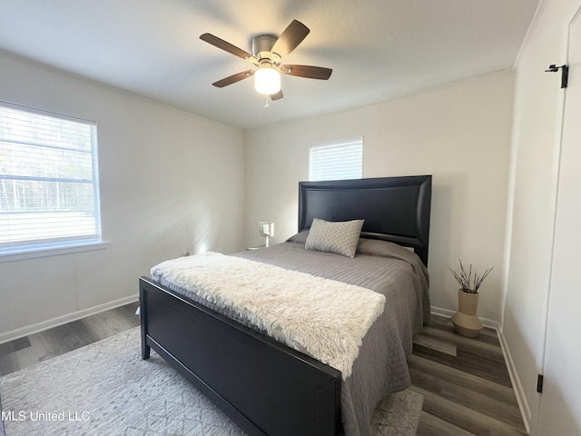 bedroom featuring hardwood / wood-style floors and ceiling fan