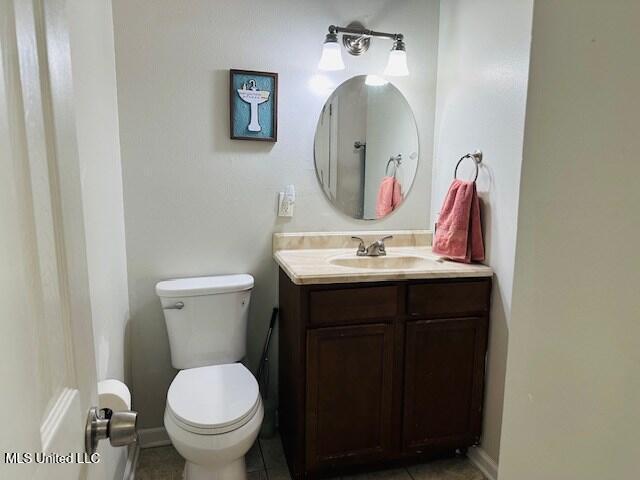 113 Richardson Rd, Picayune, MS 39466 - bathroom with vanity, toilet, and tile patterned floors
