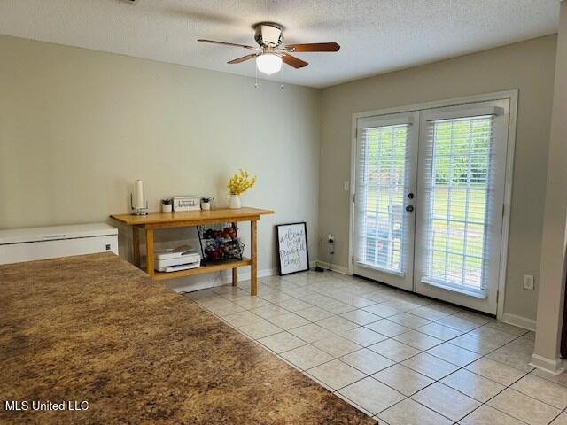 113 Richardson Rd, Picayune, MS 39466 - interior space featuring french doors, a ceiling fan, light tile patterned flooring, a textured ceiling, and baseboards