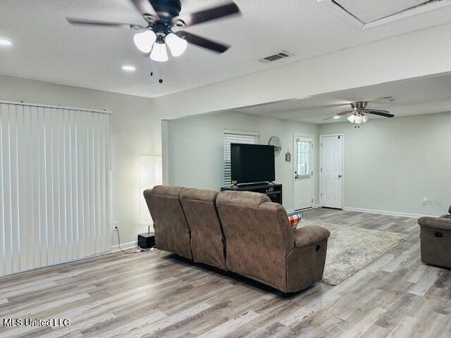 113 Richardson Rd, Picayune, MS 39466 - living room with a ceiling fan, wood finished floors, and baseboards