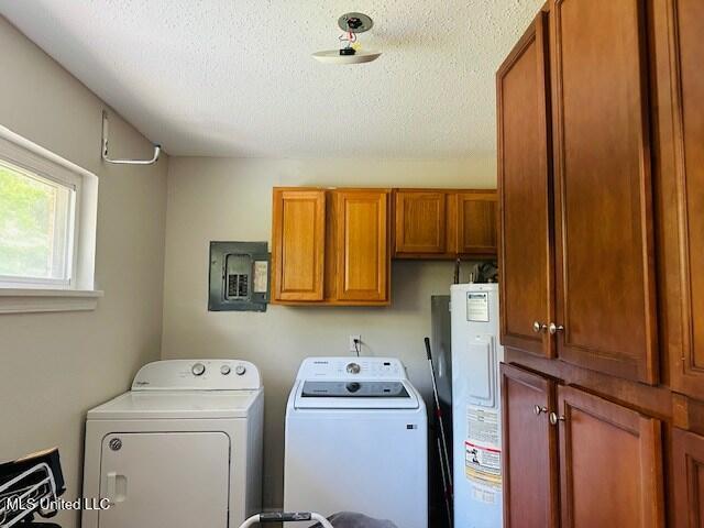 113 Richardson Rd, Picayune, MS 39466 - washroom featuring cabinet space, water heater, washing machine and dryer, electric panel, and a textured ceiling