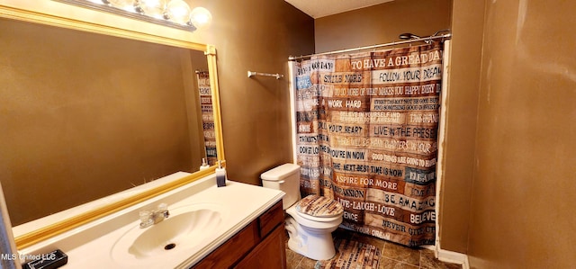 bathroom with tile patterned floors, toilet, a shower with shower curtain, and vanity
