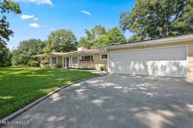 single story home with a front lawn and a garage