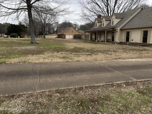 view of yard with covered porch