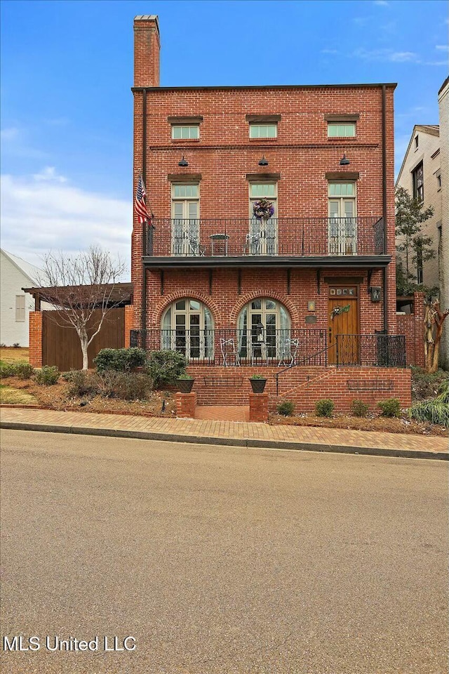 view of front of property with a balcony