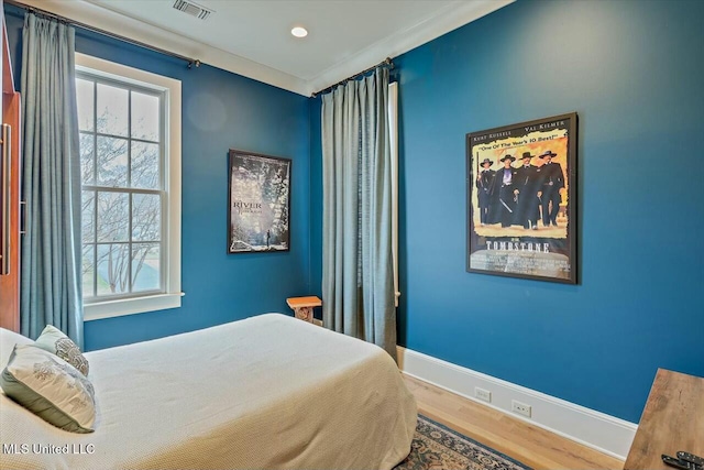 bedroom featuring hardwood / wood-style floors