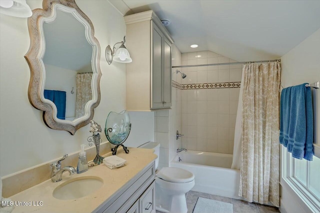 full bathroom with tile patterned floors, toilet, vaulted ceiling, vanity, and shower / bath combo with shower curtain