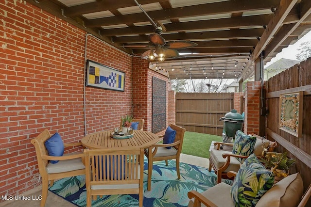 view of patio featuring ceiling fan, area for grilling, an outdoor living space, and a pergola