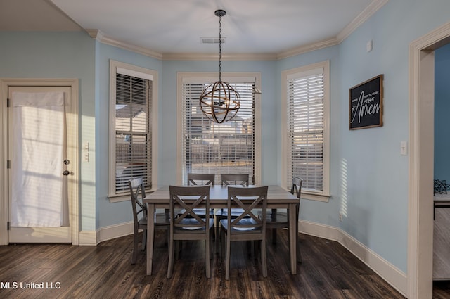 dining space featuring a notable chandelier, ornamental molding, dark wood finished floors, and baseboards