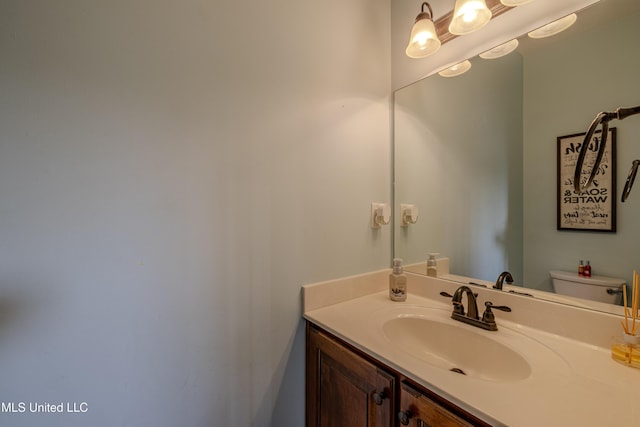 bathroom with vanity and toilet